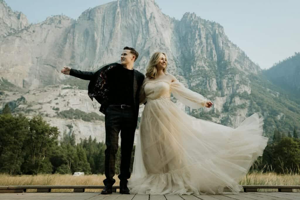 Two brides soaking up the Yosemite mountain air during the intimate elopement ceremony