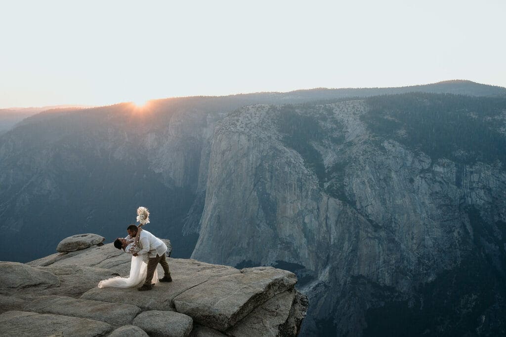Bride and groom during sunset at Taft Point in Yosemite National Park